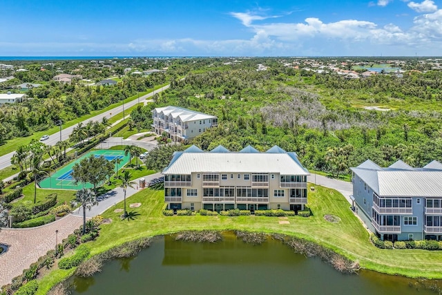 birds eye view of property with a water view