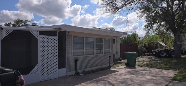 view of side of property with a patio area