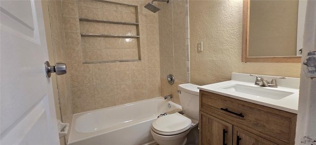 full bathroom featuring vanity, toilet, and tiled shower / bath combo