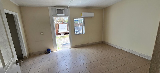 tiled empty room with a wall mounted air conditioner