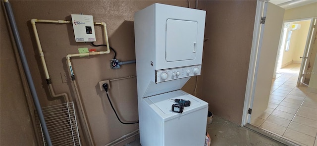 laundry area featuring stacked washing maching and dryer