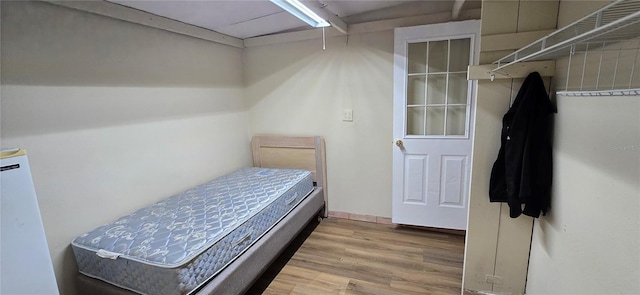 bedroom featuring wood-type flooring