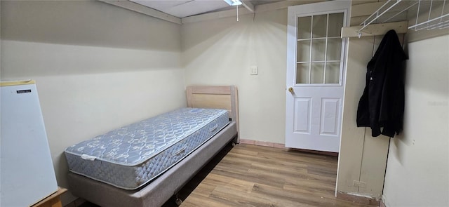 bedroom featuring hardwood / wood-style flooring