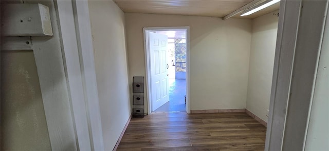 hall with dark hardwood / wood-style flooring