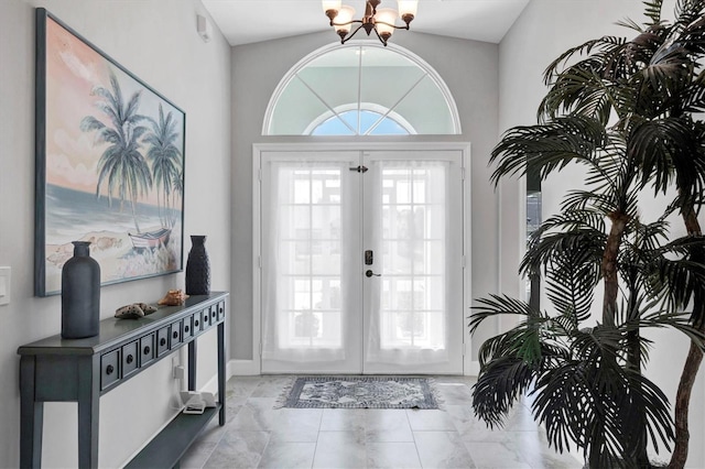 entryway with an inviting chandelier and french doors