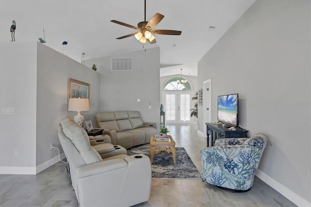 living area with high vaulted ceiling, baseboards, visible vents, and french doors