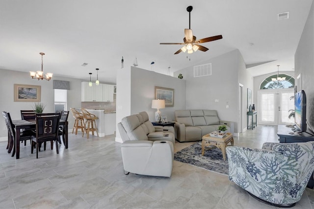 living area with high vaulted ceiling, french doors, and visible vents