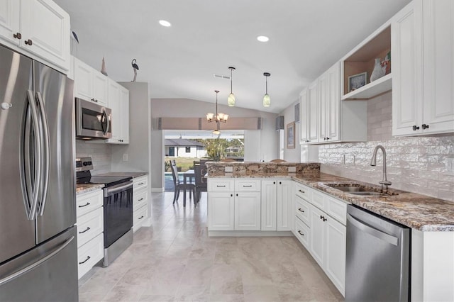 kitchen with open shelves, appliances with stainless steel finishes, vaulted ceiling, a sink, and a peninsula