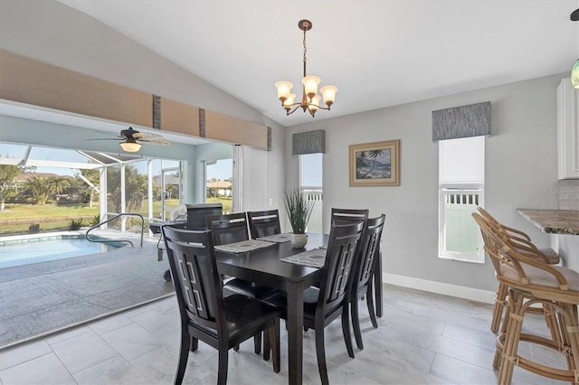 dining area with a sunroom, baseboards, vaulted ceiling, and ceiling fan with notable chandelier