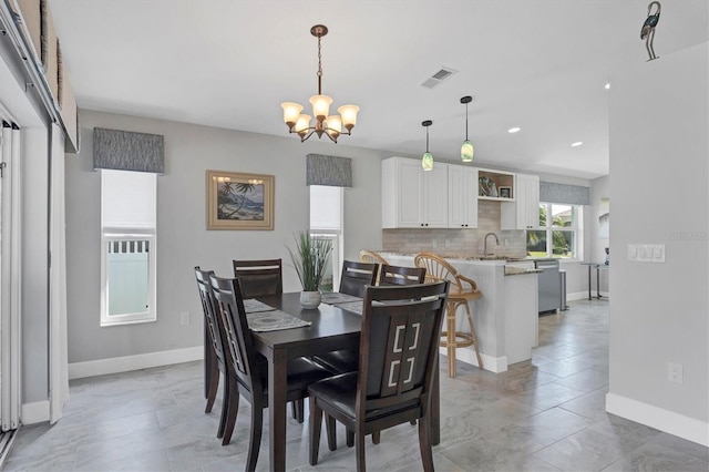 dining room with baseboards, recessed lighting, visible vents, and an inviting chandelier