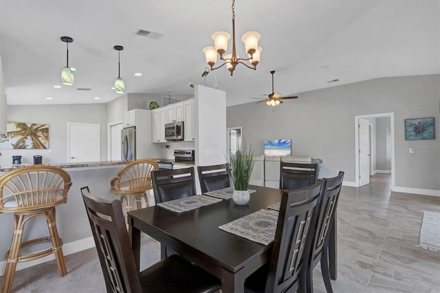 dining room featuring visible vents, vaulted ceiling, baseboards, and ceiling fan with notable chandelier