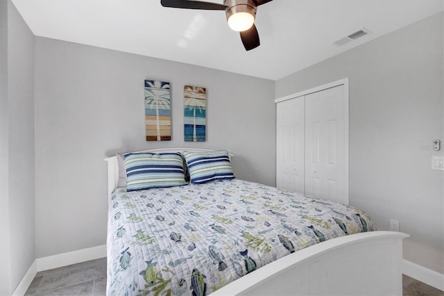 bedroom featuring a closet, visible vents, ceiling fan, and baseboards