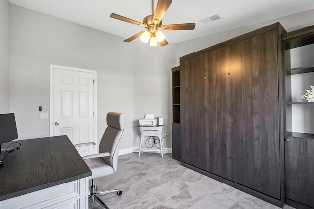 office area with ceiling fan, visible vents, and baseboards