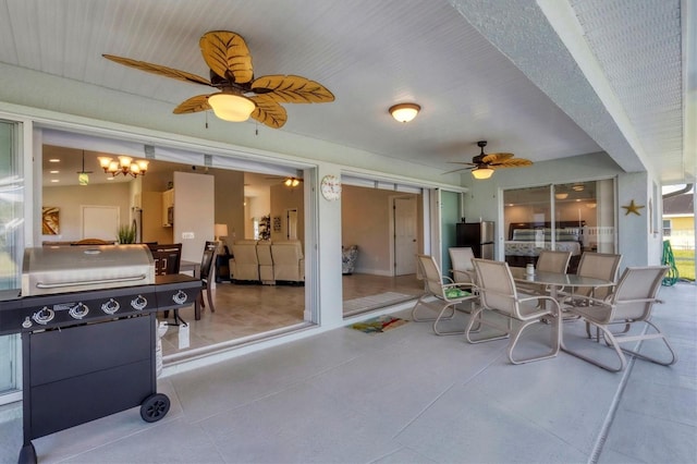 view of patio with a grill and ceiling fan