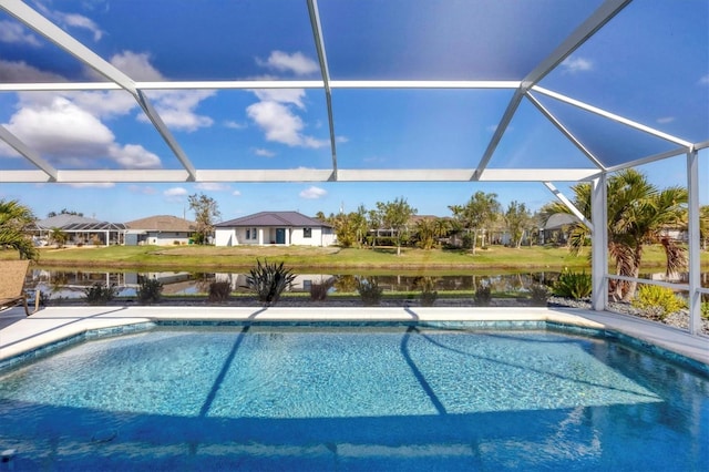 outdoor pool featuring a water view and a lanai