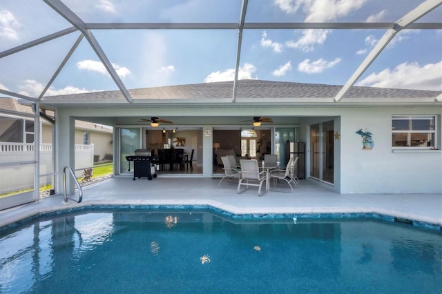 outdoor pool featuring a lanai, ceiling fan, grilling area, and a patio