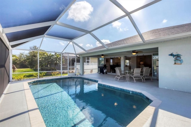 pool with a ceiling fan, a lanai, a patio, and grilling area