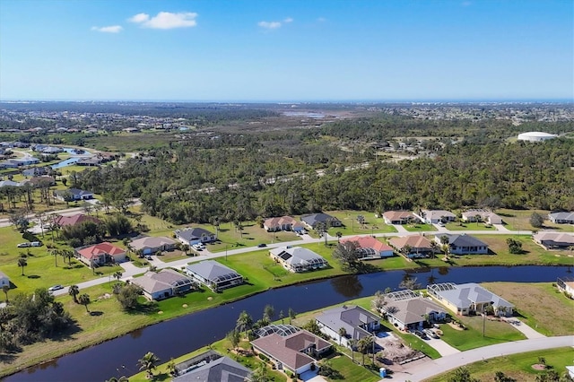 birds eye view of property featuring a water view and a residential view