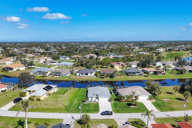 aerial view with a water view and a residential view