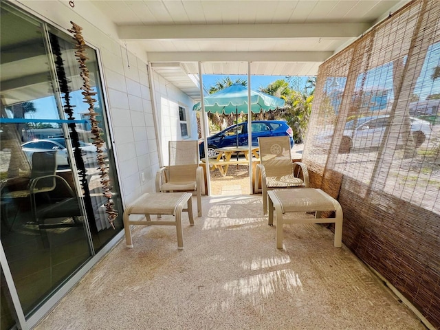 sunroom / solarium with beam ceiling