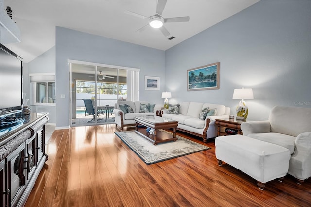 living room featuring wood-type flooring and ceiling fan