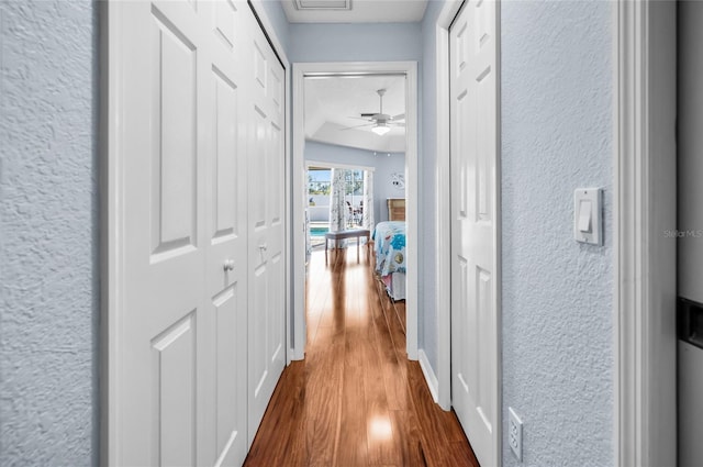 hallway featuring wood-type flooring