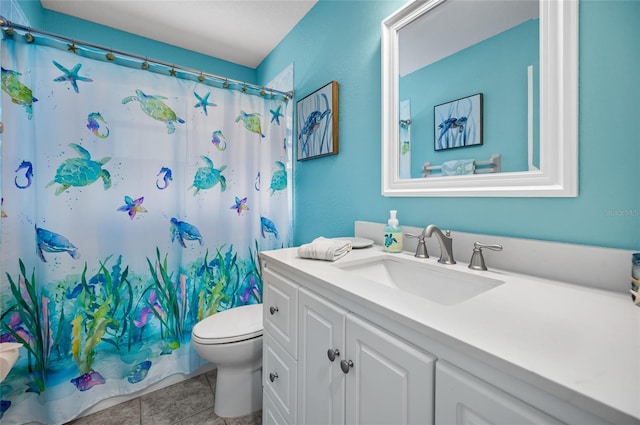 bathroom featuring vanity, curtained shower, tile patterned floors, and toilet