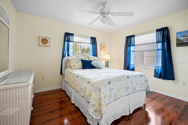 bedroom with ceiling fan and dark hardwood / wood-style flooring