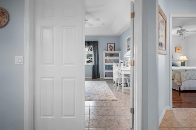 hallway featuring light tile patterned floors