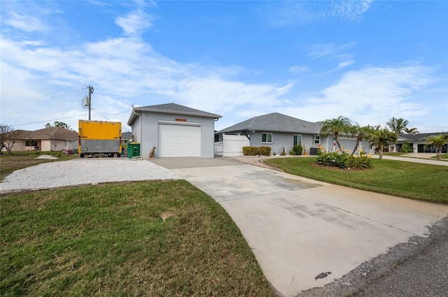 ranch-style house featuring a garage and a front yard