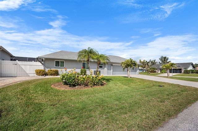 single story home featuring a garage and a front lawn