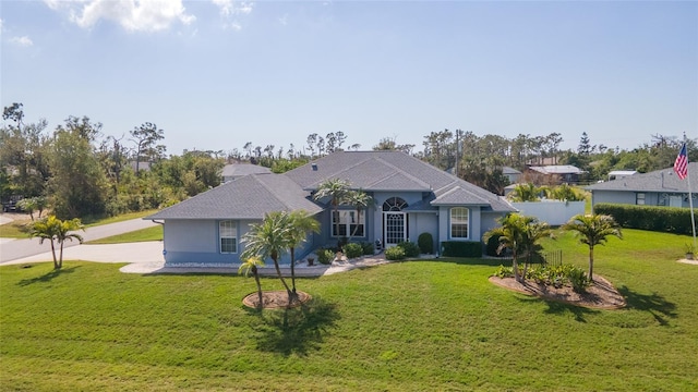 single story home featuring a front yard