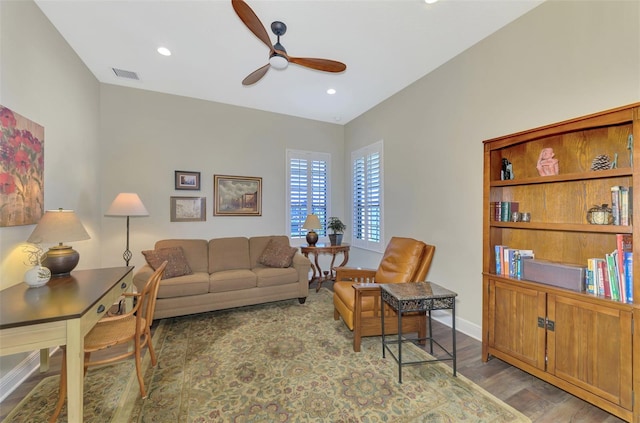 living room with ceiling fan and wood-type flooring