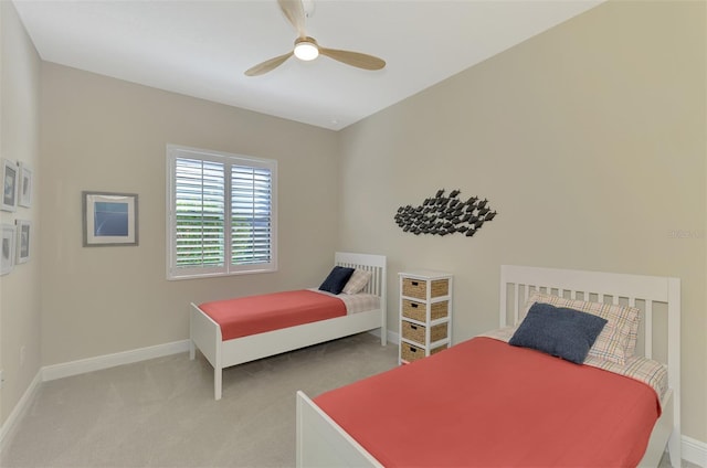 bedroom featuring ceiling fan and light carpet