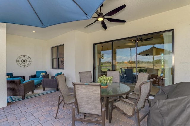 view of patio / terrace with ceiling fan and an outdoor hangout area