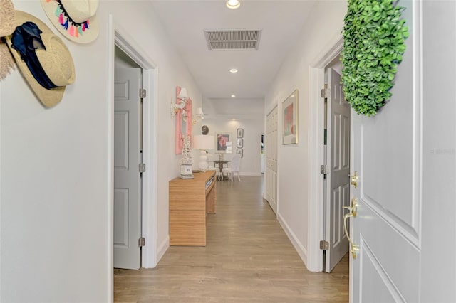 corridor featuring light hardwood / wood-style floors