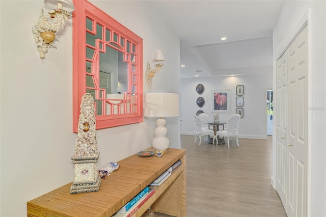 hall with hardwood / wood-style floors