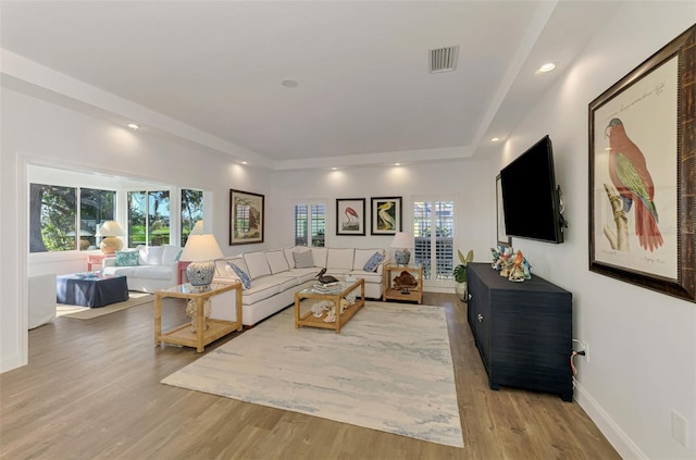 living room with light hardwood / wood-style floors