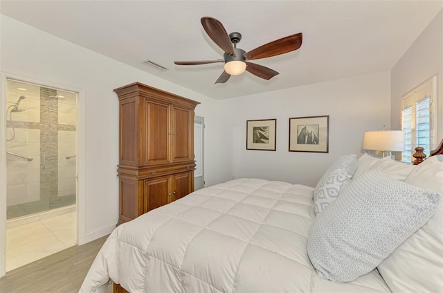 bedroom with ensuite bath, light hardwood / wood-style floors, and ceiling fan