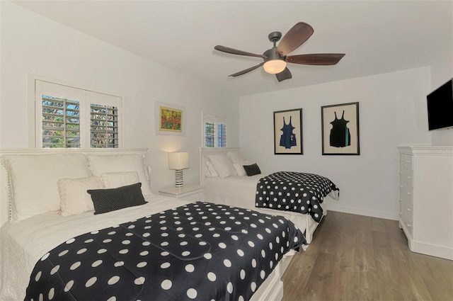 bedroom featuring hardwood / wood-style floors and ceiling fan