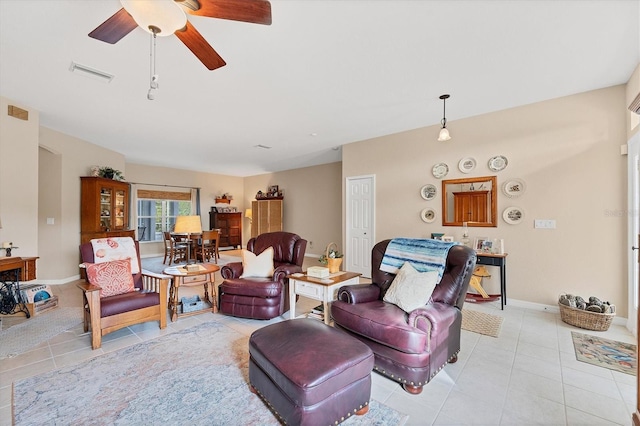 living room with light tile patterned flooring and ceiling fan