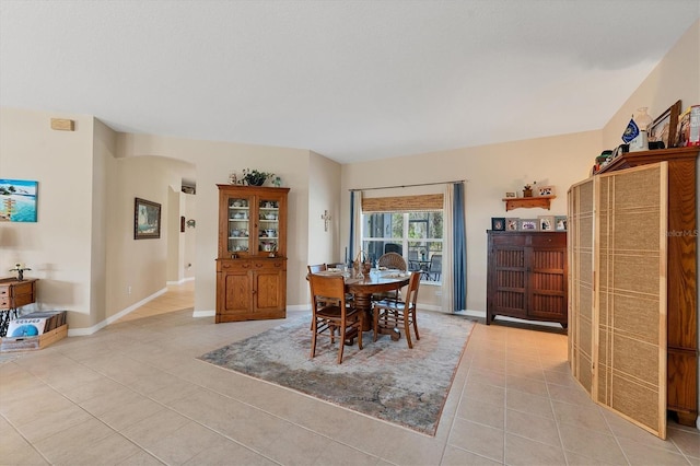 dining space with light tile patterned floors