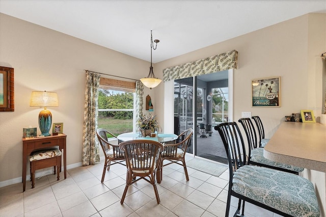 dining area featuring light tile patterned floors