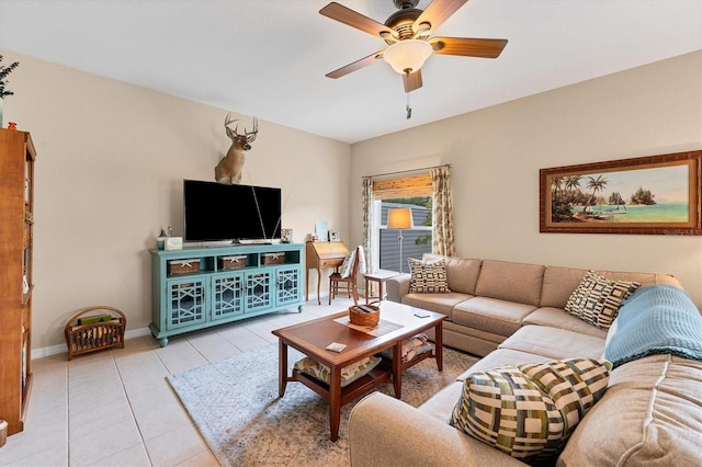 tiled living room with ceiling fan