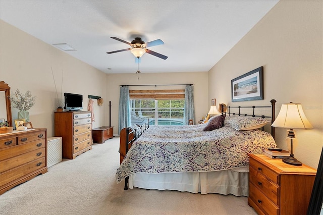 carpeted bedroom with access to outside and ceiling fan