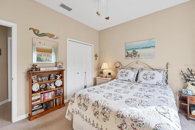 carpeted bedroom with a closet