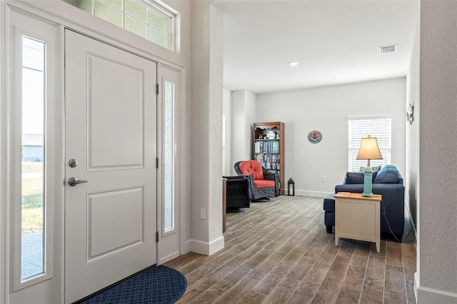 foyer entrance with hardwood / wood-style floors