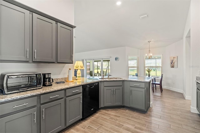 kitchen featuring gray cabinets, dishwasher, sink, and kitchen peninsula