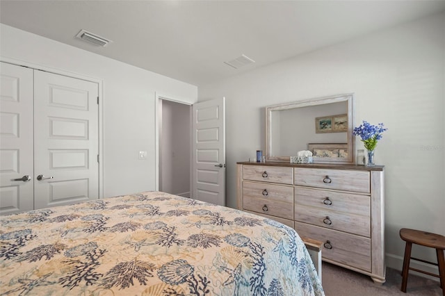 carpeted bedroom with a closet