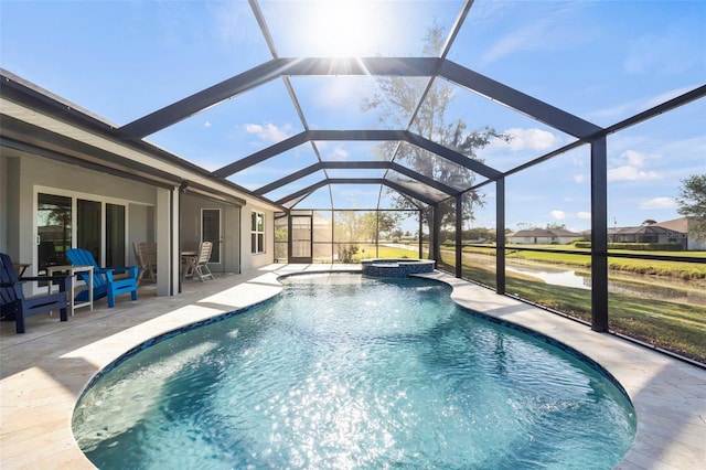 view of swimming pool featuring a lanai, a patio, and an in ground hot tub